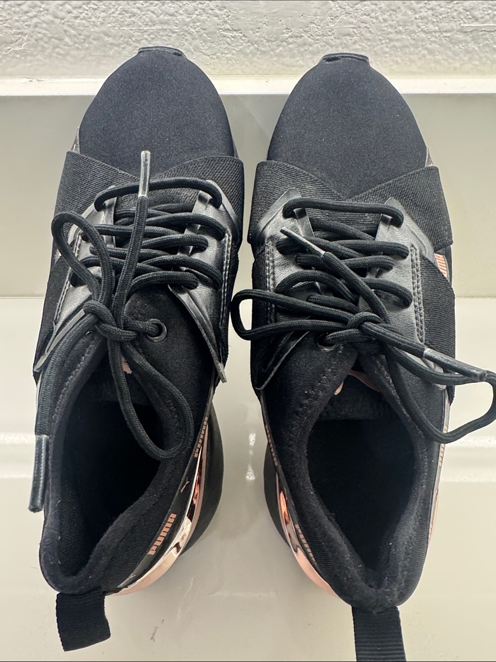 Puma Women’s Black Sneakers with Rose Gold Heel Detail